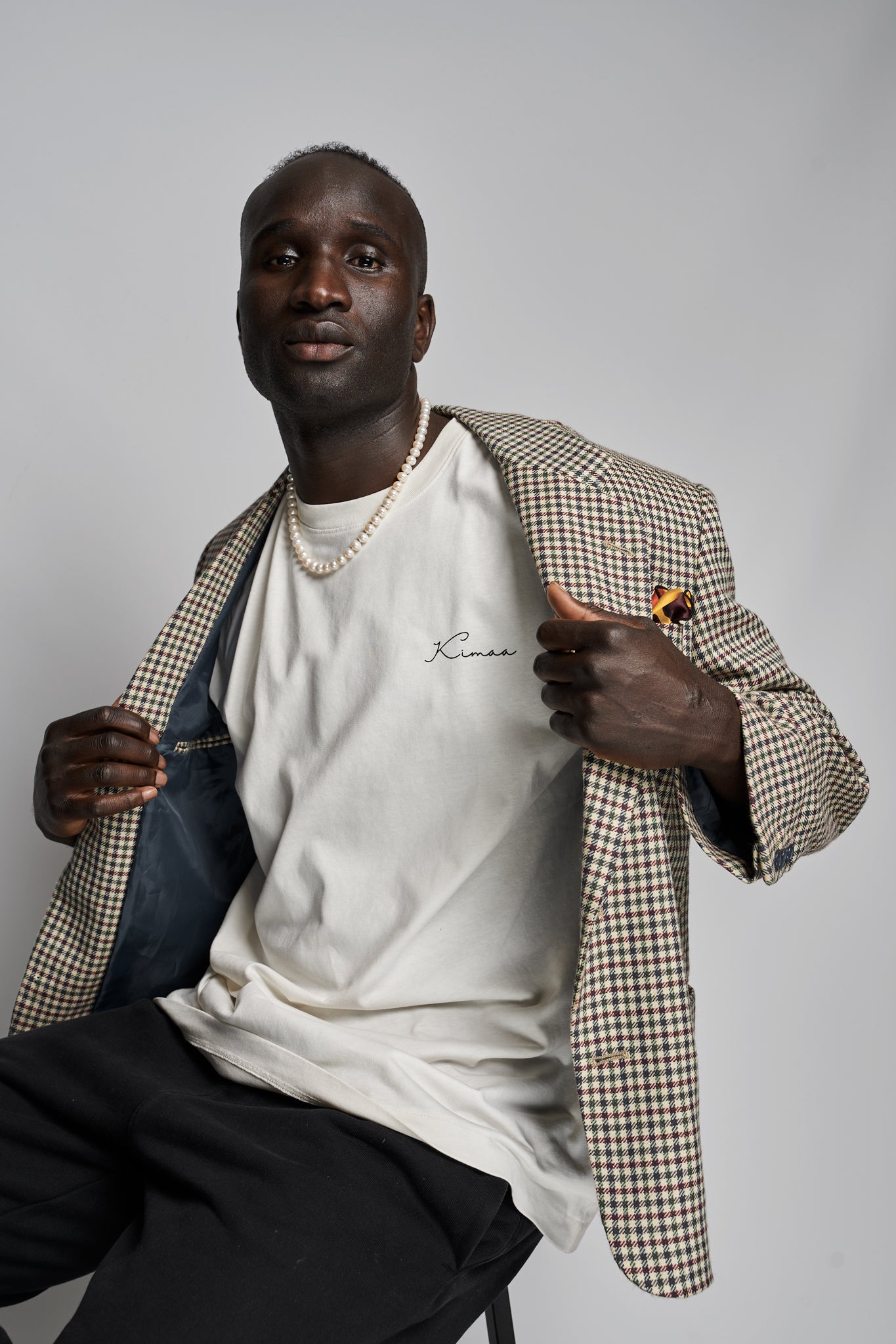 Beige organic cotton t-shirt from Kimaa Collective – Afro-Nordic streetwear