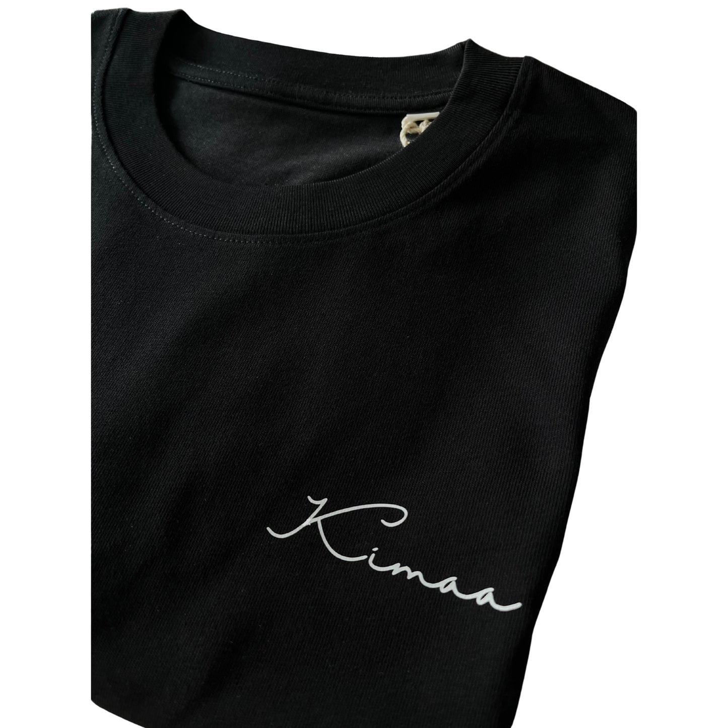 Detail view of Kimaa logo on Suutoo black organic cotton T-shirt