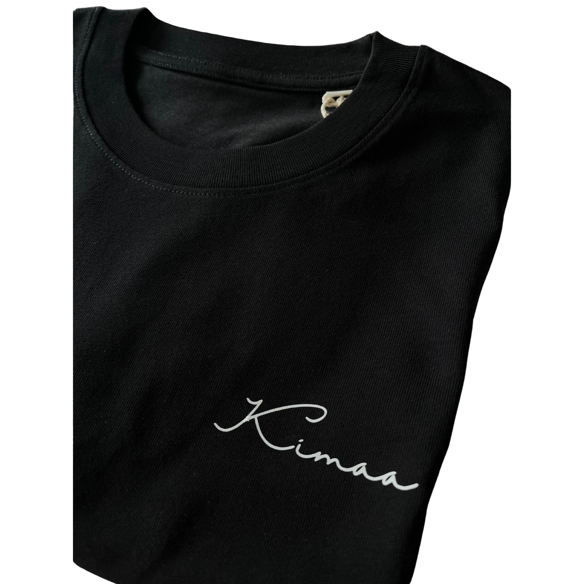 Detail view of Kimaa logo on Suutoo black organic cotton T-shirt